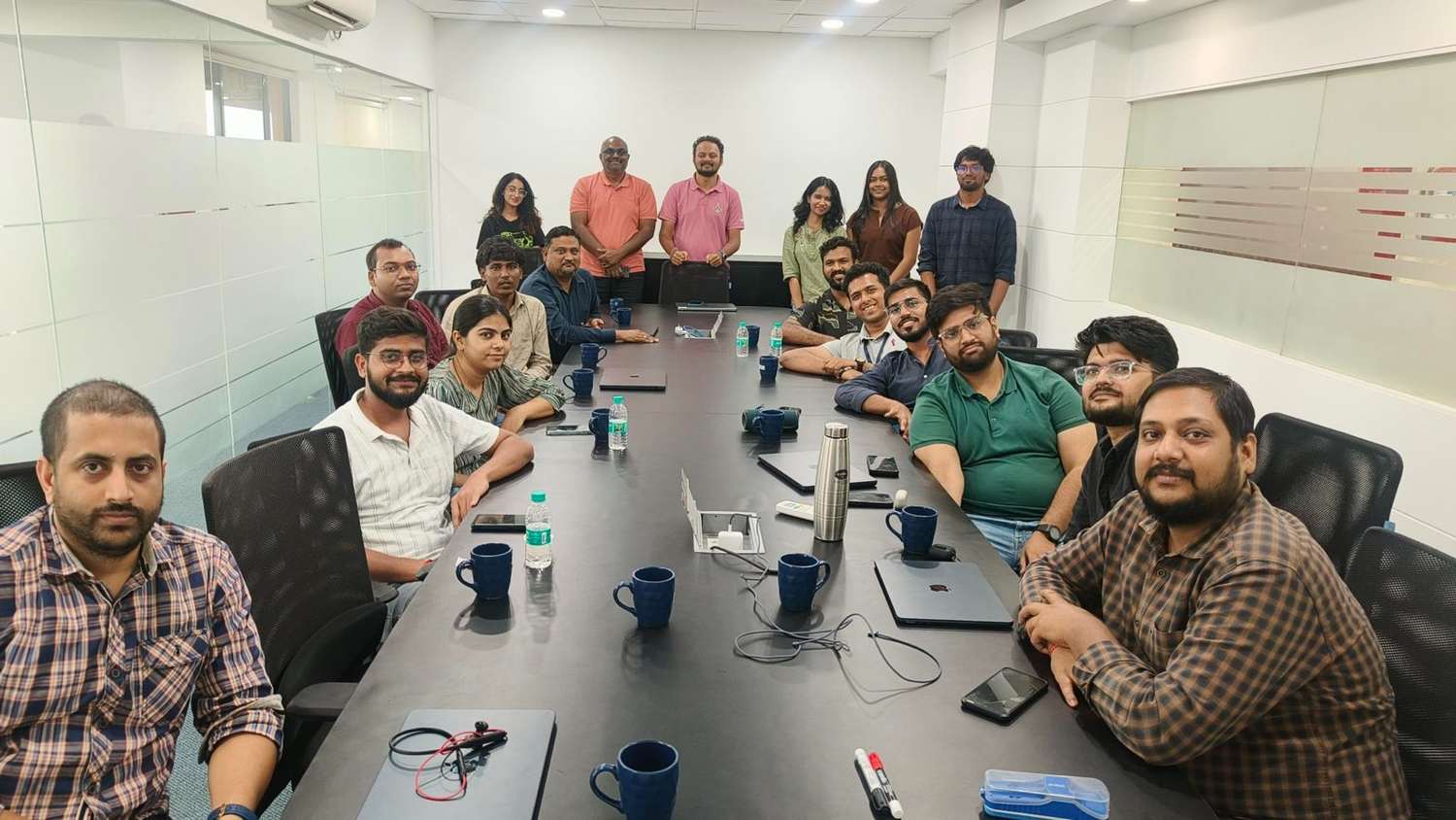 The tiramai team around the long table at a Collab session
